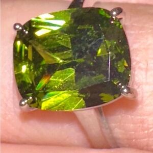 Peridot “dirty martini” cocktail ring by Ready-Made